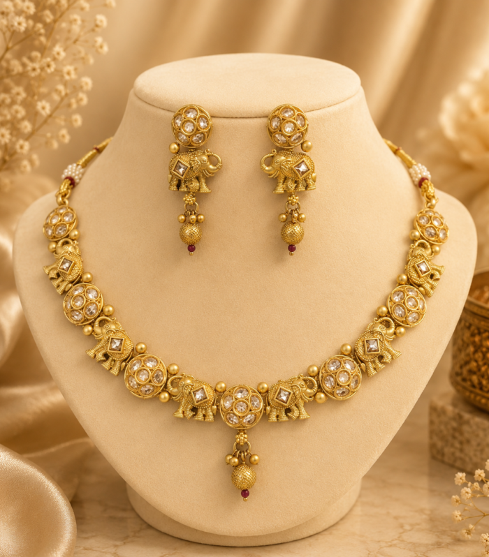Gold elephant motif kundan necklace set with mesh ball pendant by Samaya Jewellery